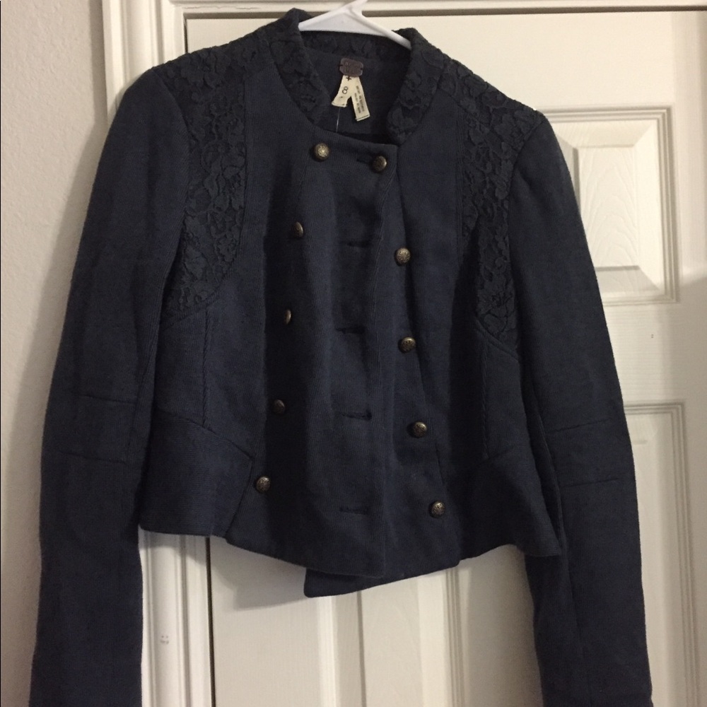 A super fun teal blazer with bronze buttons